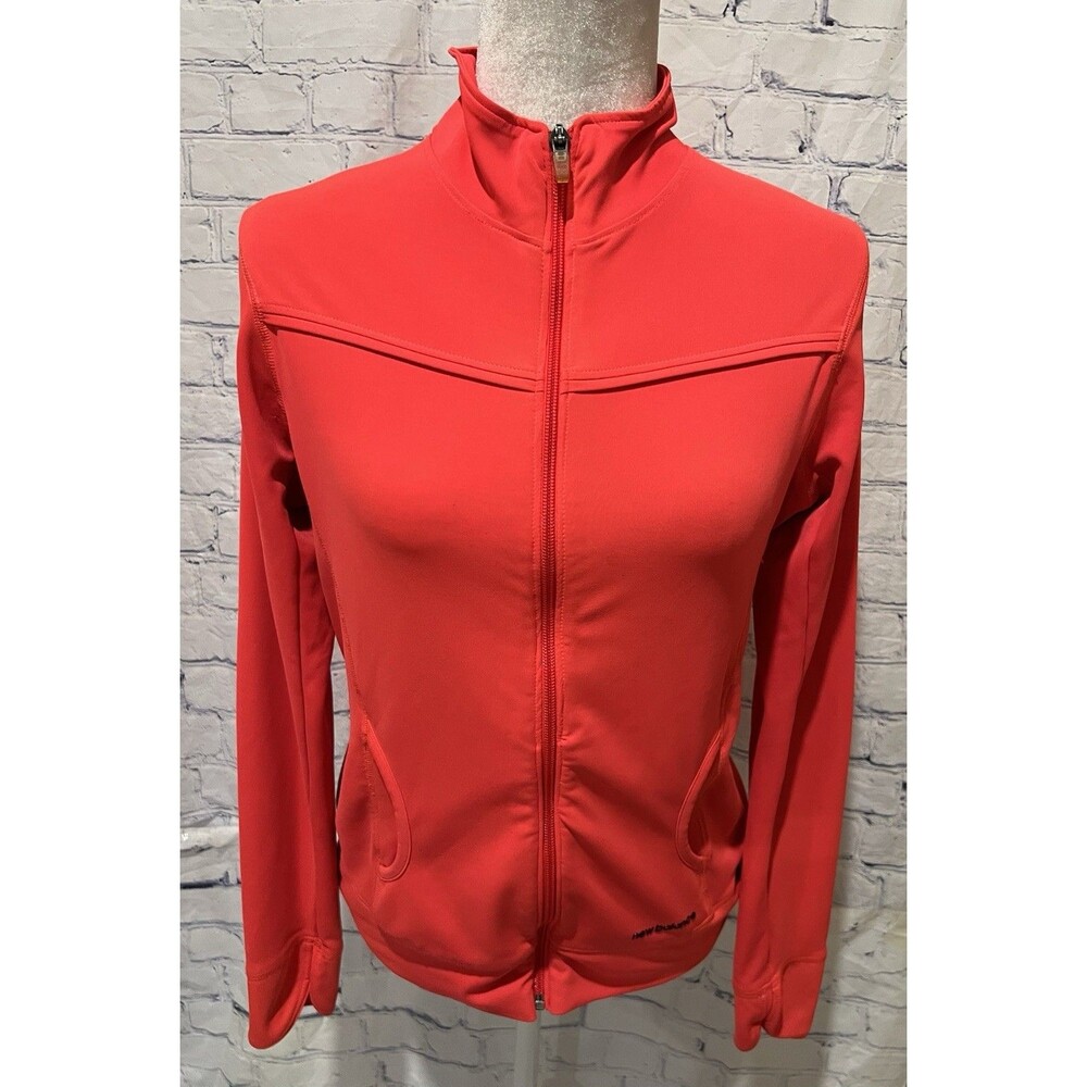 New Balance women's full-zip track jacket in a bright coral color Medium